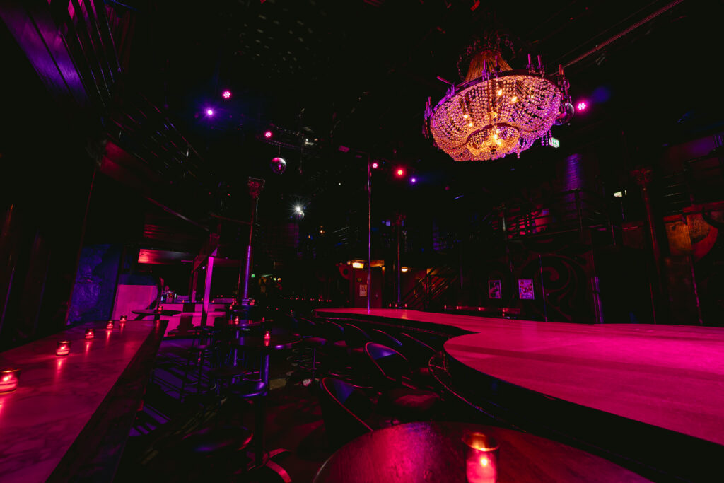 Centrefold Lounge main stage with chandelier and candlelit tables